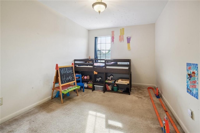 bedroom featuring carpet and baseboards