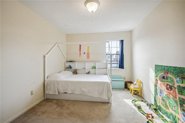 carpeted bedroom with baseboards