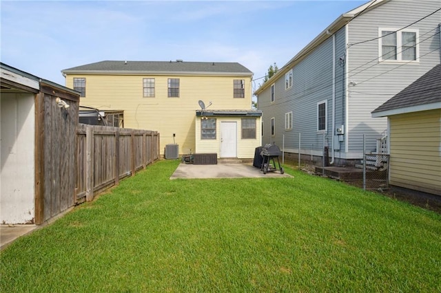 back of property featuring a patio, a fenced backyard, central AC unit, and a lawn