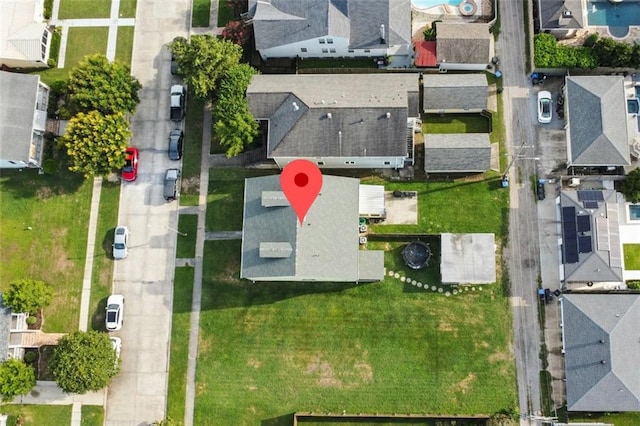birds eye view of property with a residential view