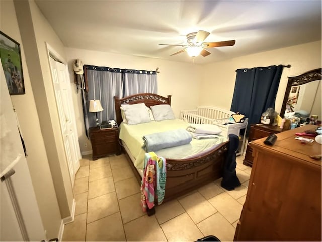 4928 Sandalwood St, New Orleans, LA 70127 - bedroom featuring light tile patterned floors, a closet, baseboards, and ceiling fan