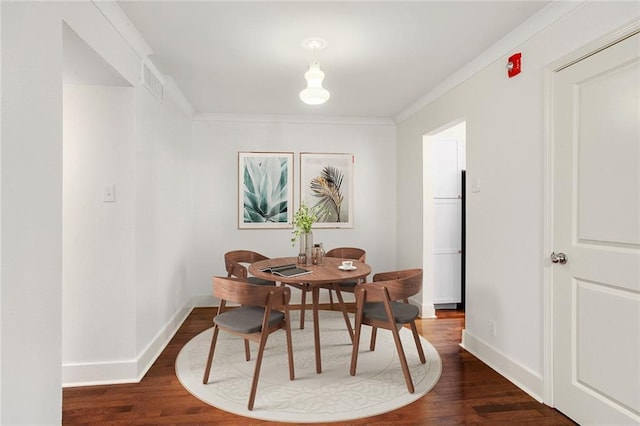1430 Jackson Ave Unit 302, New Orleans, LA 70130 - dining room with dark wood-style flooring and ornamental molding
