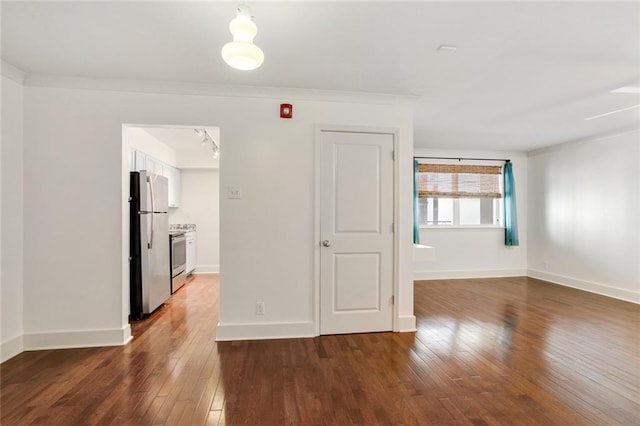 1430 Jackson Ave Unit 302, New Orleans, LA 70130 - spare room featuring hardwood / wood-style floors and baseboards