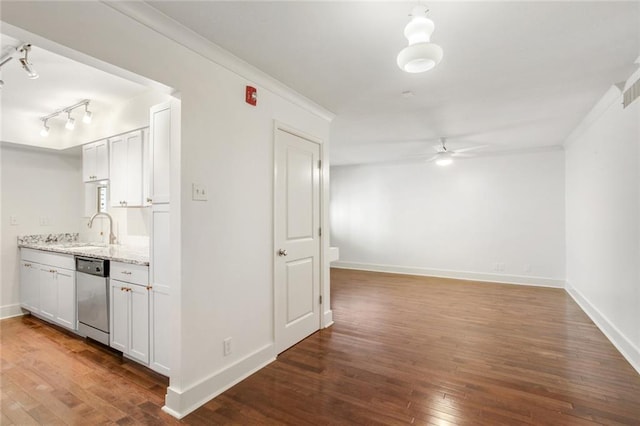 1430 Jackson Ave Unit 302, New Orleans, LA 70130 - kitchen featuring stainless steel dishwasher, ceiling fan, dark wood-type flooring, ornamental molding, and light stone countertops