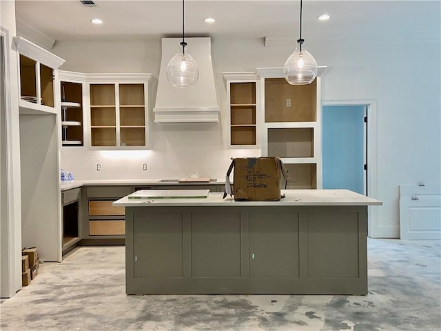 1169 Fox Sparrow Loop, Madisonville, LA 70447 - kitchen featuring premium range hood, an island with sink, pendant lighting, concrete flooring, and recessed lighting