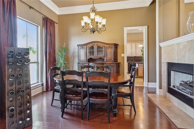 318 Cape Breton Dr, Slidell, LA 70458 - dining area featuring a healthy amount of sunlight, dark wood-type flooring, an inviting chandelier, and ornamental molding