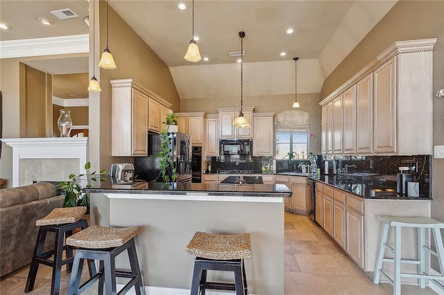 318 Cape Breton Dr, Slidell, LA 70458 - kitchen featuring visible vents, a kitchen bar, black appliances, light brown cabinets, and a peninsula