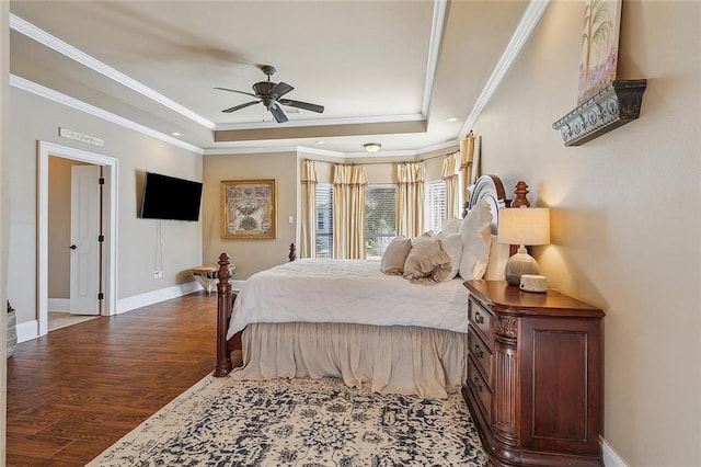 318 Cape Breton Dr, Slidell, LA 70458 - bedroom featuring a raised ceiling, ornamental molding, a ceiling fan, wood finished floors, and baseboards