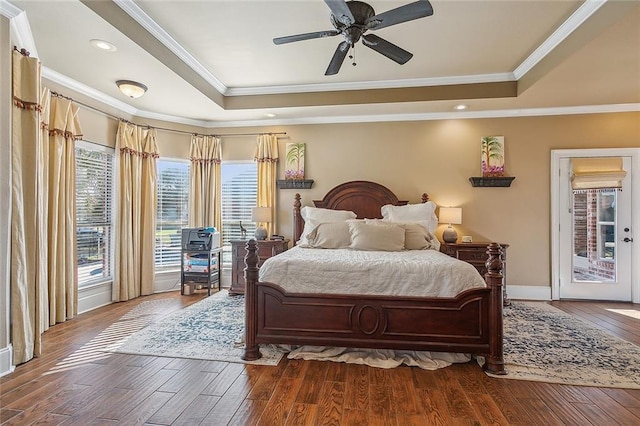 318 Cape Breton Dr, Slidell, LA 70458 - bedroom with access to exterior, crown molding, baseboards, wood finished floors, and a raised ceiling