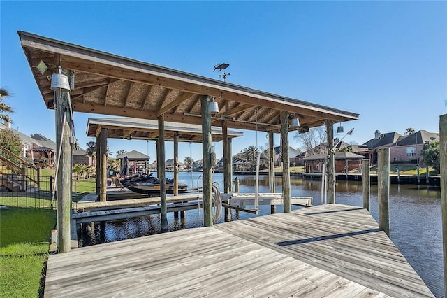 318 Cape Breton Dr, Slidell, LA 70458 - dock area with boat lift, a residential view, and a water view