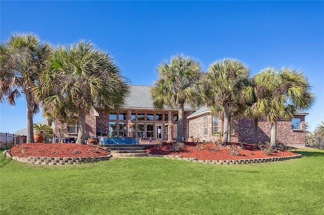 318 Cape Breton Dr, Slidell, LA 70458 - rear view of property with a yard and brick siding