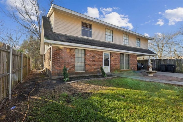 119 Vine St, New Iberia, LA 70560 - rear view of house with a patio area, a fenced backyard, and brick siding