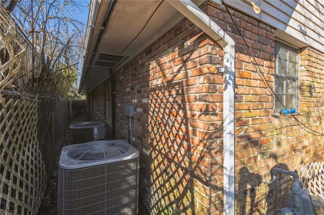 119 Vine St, New Iberia, LA 70560 - view of side of property with brick siding and a central air condition unit