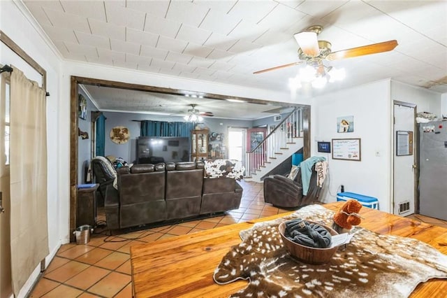 119 Vine St, New Iberia, LA 70560 - living room with a ceiling fan, ornamental molding, stairway, and tile patterned floors