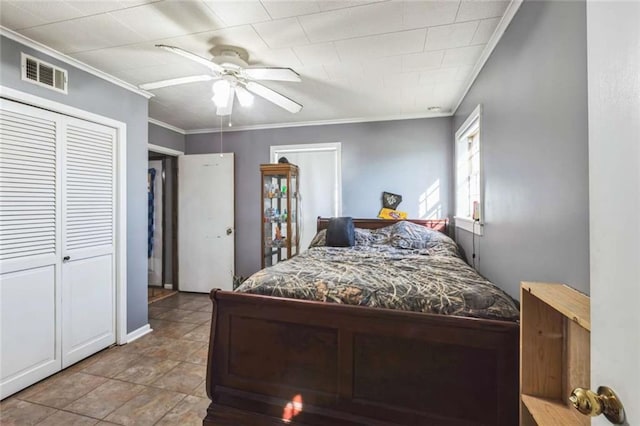 119 Vine St, New Iberia, LA 70560 - bedroom featuring ornamental molding, stone finish floors, ceiling fan, and a closet