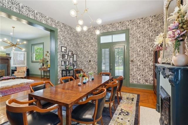 1930 Napoleon Ave, New Orleans, LA 70115 - dining area featuring a chandelier and wallpapered walls