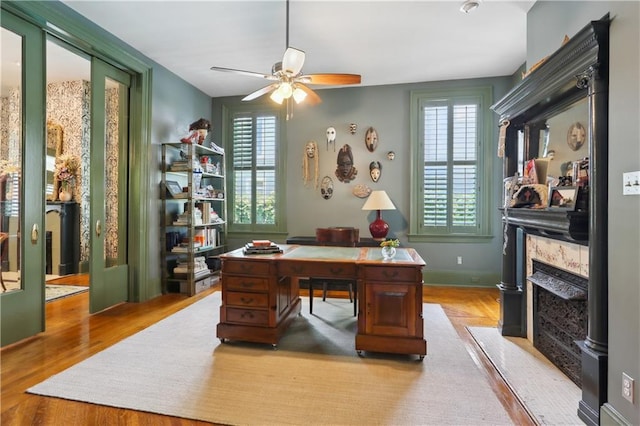 1930 Napoleon Ave, New Orleans, LA 70115 - office area featuring a ceiling fan, plenty of natural light, wood finished floors, and a premium fireplace