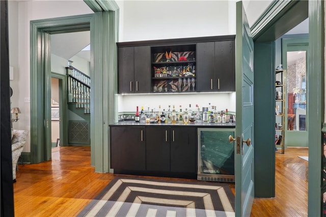 1930 Napoleon Ave, New Orleans, LA 70115 - indoor dry bar featuring wine cooler and light wood-style flooring