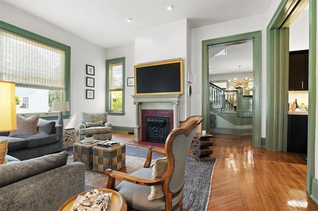 1930 Napoleon Ave, New Orleans, LA 70115 - living area with a brick fireplace, hardwood / wood-style flooring, stairway, plenty of natural light, and recessed lighting