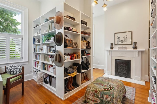 1930 Napoleon Ave, New Orleans, LA 70115 - sitting room with wood finished floors and a brick fireplace