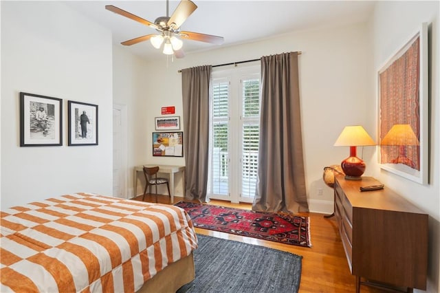 1930 Napoleon Ave, New Orleans, LA 70115 - bedroom with wood finished floors, a ceiling fan, and access to outside