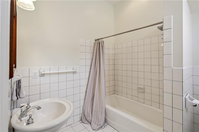 1930 Napoleon Ave, New Orleans, LA 70115 - bathroom featuring shower / bath combo, tile walls, and tile patterned flooring