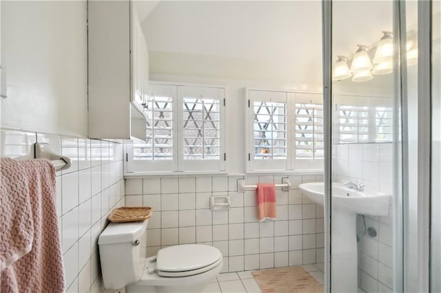 1930 Napoleon Ave, New Orleans, LA 70115 - bathroom featuring toilet and tile walls