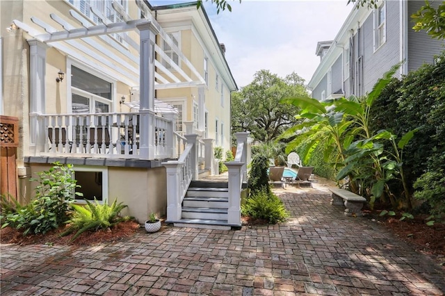 1930 Napoleon Ave, New Orleans, LA 70115 - view of patio with a pergola and stairway