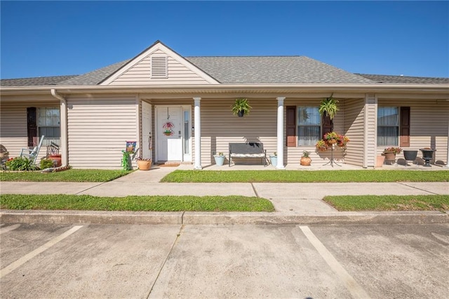 1700 Marseille Dr Unit 2, La Place, LA 70068 - ranch-style house featuring covered porch, roof with shingles, and uncovered parking