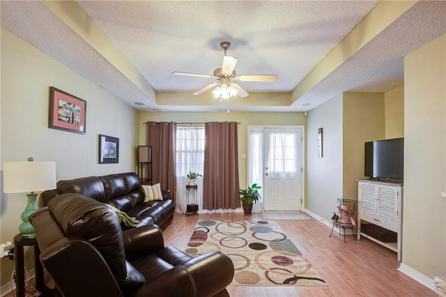 1700 Marseille Dr Unit 2, La Place, LA 70068 - living area with a raised ceiling, wood finished floors, and a textured ceiling