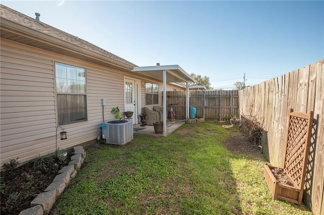 1700 Marseille Dr Unit 2, La Place, LA 70068 - view of yard with a patio, central AC, and a fenced backyard