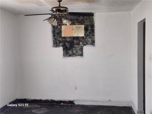 spare room with ceiling fan