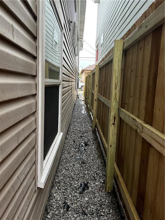 view of side of property with fence