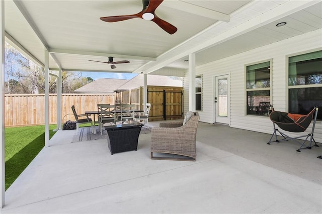 41379 Schafer Dr, Hammond, LA 70403 - fenced backyard featuring a ceiling fan, outdoor dining space, and a patio area