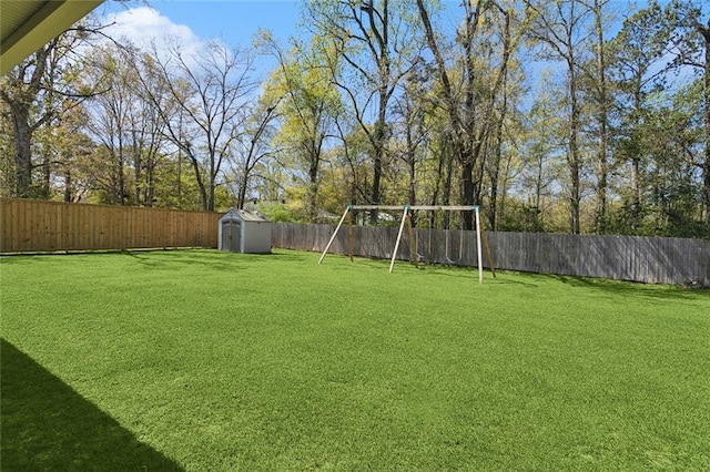 41379 Schafer Dr, Hammond, LA 70403 - fenced backyard with a storage shed and a playground