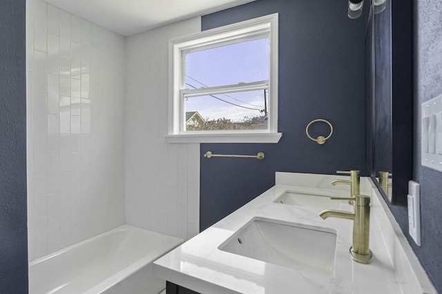 full bathroom with a sink, shower / bath combination, and double vanity