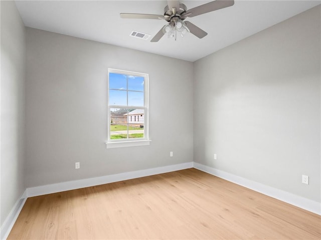 72694 Robindale Dr, Covington, LA 70435 - unfurnished room featuring visible vents, baseboards, a ceiling fan, and wood finished floors