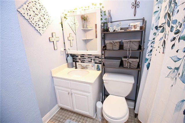 3805 Houma Blvd Unit 219A, Metairie, LA 70006 - bathroom featuring vanity, decorative backsplash, tile patterned floors, and a shower with curtain
