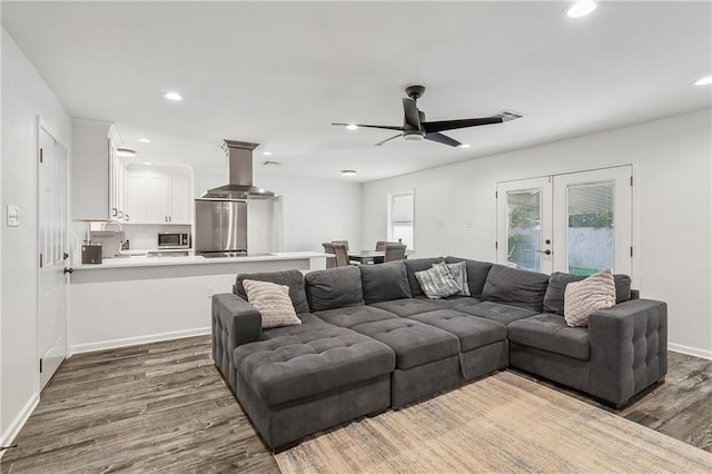 living area with baseboards, recessed lighting, french doors, wood finished floors, and a ceiling fan