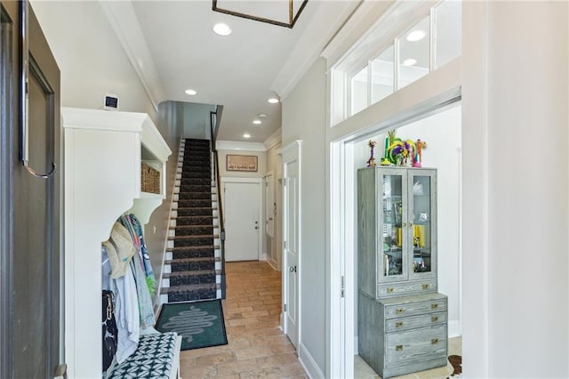 2109 Prytania St, New Orleans, LA 70130 - entrance foyer with ornamental molding, recessed lighting, and stairs