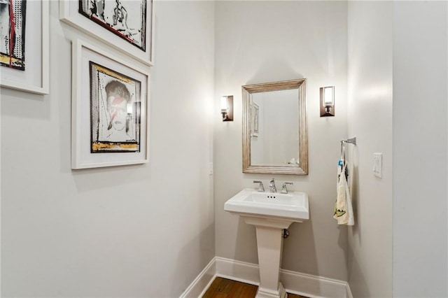 2109 Prytania St, New Orleans, LA 70130 - bathroom with baseboards and wood finished floors