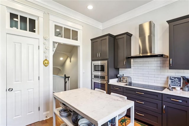 2109 Prytania St, New Orleans, LA 70130 - kitchen with wall chimney range hood, appliances with stainless steel finishes, open shelves, tasteful backsplash, and crown molding