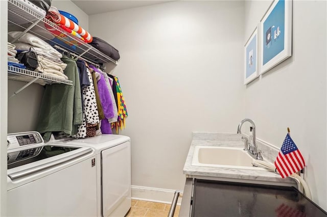 2109 Prytania St, New Orleans, LA 70130 - laundry area featuring washing machine and clothes dryer and baseboards