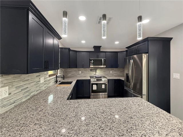 508 Sena Dr, Metairie, LA 70005 - kitchen with appliances with stainless steel finishes, light stone counters, tasteful backsplash, pendant lighting, and recessed lighting