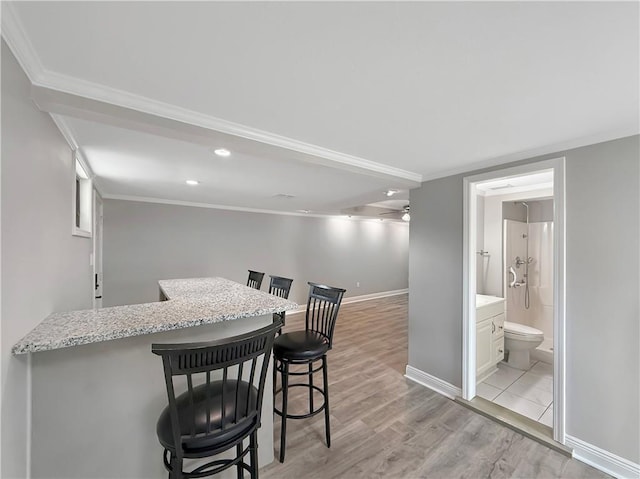 508 Sena Dr, Metairie, LA 70005 - bar with light wood finished floors, crown molding, and recessed lighting