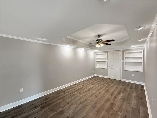 508 Sena Dr, Metairie, LA 70005 - unfurnished bedroom with crown molding, a tray ceiling, dark wood-style flooring, a closet, and a ceiling fan
