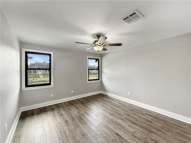 508 Sena Dr, Metairie, LA 70005 - spare room with wood finished floors and ceiling fan