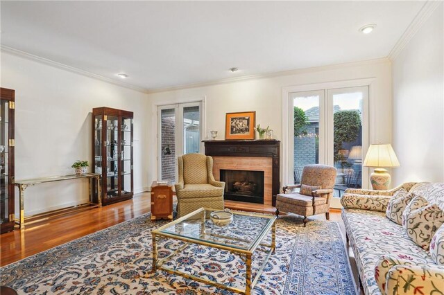 805 Rue Royal St, Metairie, LA 70005 - living room with ornamental molding, a fireplace, baseboards, and wood finished floors