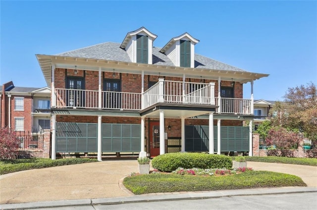 805 Rue Royal St, Metairie, LA 70005 - view of front of house with a balcony and brick siding