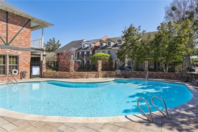 805 Rue Royal St, Metairie, LA 70005 - community pool featuring a patio area, fence, and a residential view